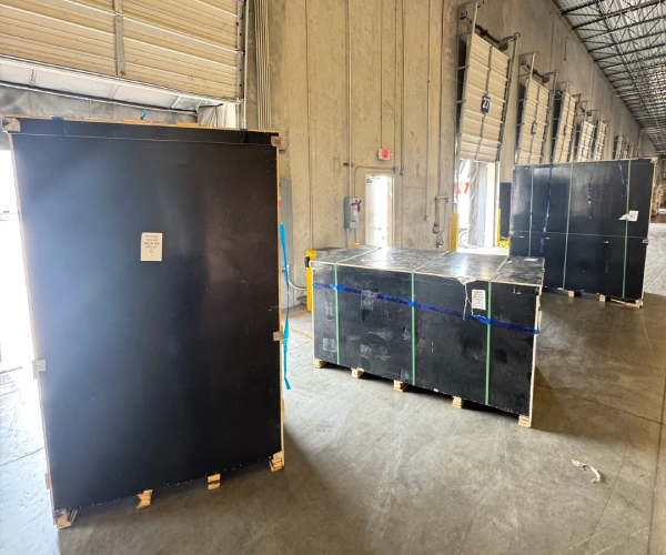 Export crates containing the custom bronze bluebird sculptures safely arrived at the U.S. destination warehouse.