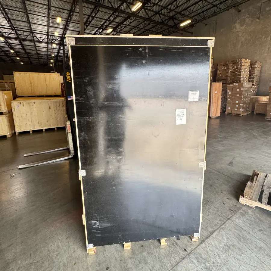 Custom bronze bluebird sculpture crate safely stored at the destination warehouse and ready for final delivery.