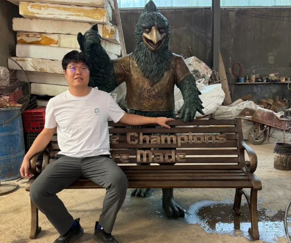 Final factory inspection of the completed bronze bluebird sculpture and custom bench before shipment.