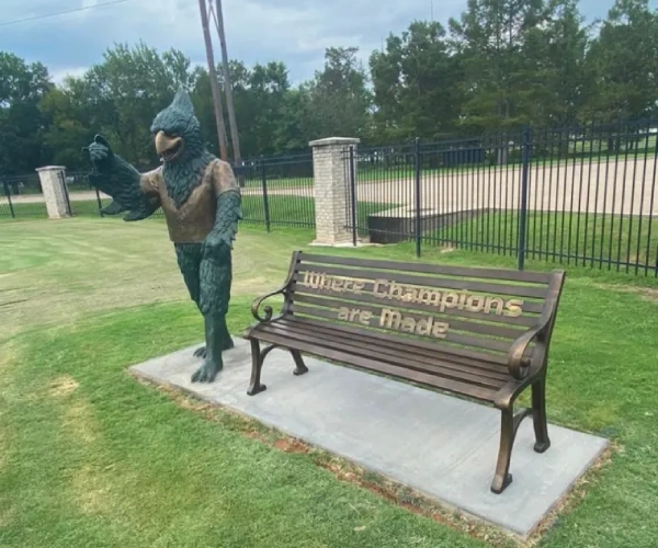 Custom bronze bluebird sculpture installed beside the personalized bench at the client’s site in Little Rock, Arkansas.
