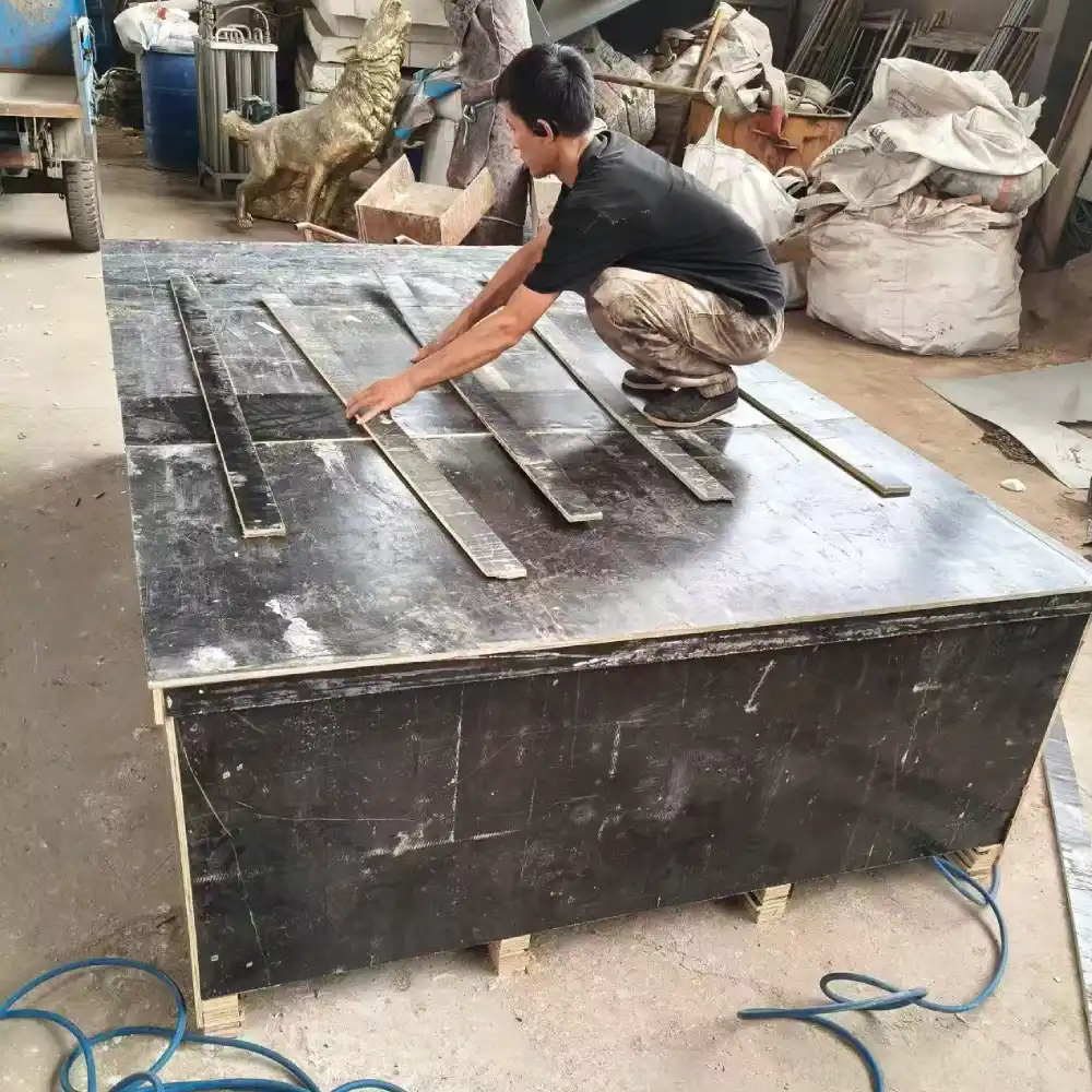 Worker completing the final sealing of the export crate containing the custom bronze horse sculpture before shipment to Kuwait.