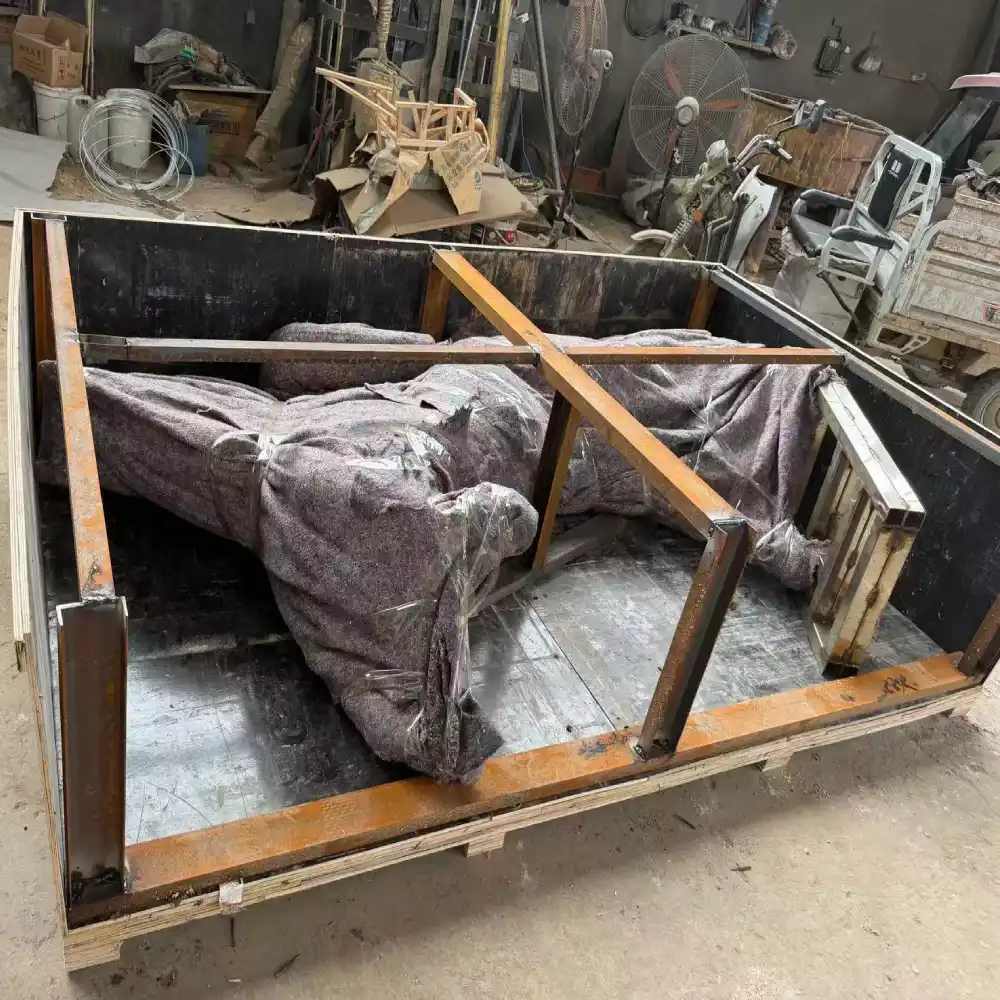 Custom bronze horse sculpture secured inside a reinforced wooden export crate for international transportation.
