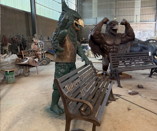 Completed custom bronze bluebird sculptures with personalized benches at the Yun Sculpture factory before shipment to Arkansas.
