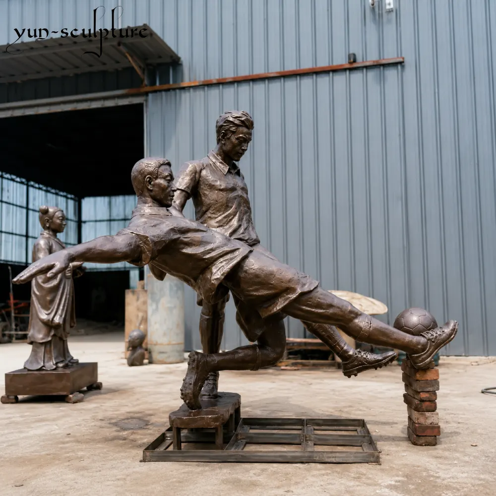 A life-size custom bronze football sculpture group depicting a dynamic tackle between two players. Hand-cast at the Yun Sculpture foundry, this piece illustrates our ability to build spatially complex action poses from scratch based on specific client reference material.