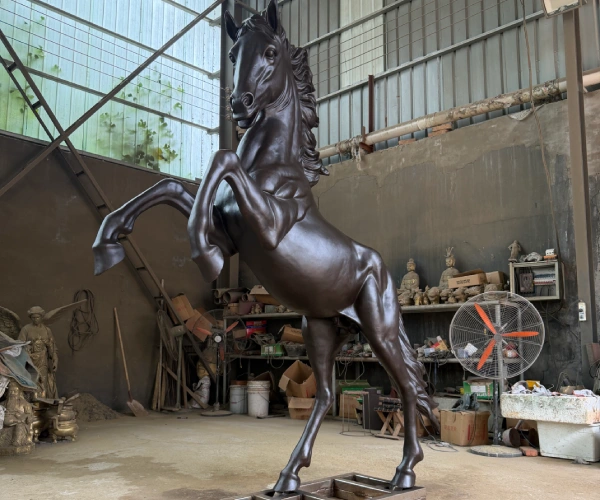 Finished custom bronze horse sculpture showing the final rearing pose, balanced proportions and completed patina for the Kuwait project.