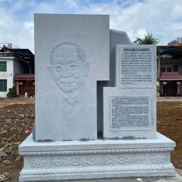 Low relief marble portrait sculpture carved for a memorial monument