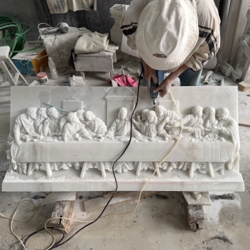 Medium relief marble sculpture being hand refined during the carving process