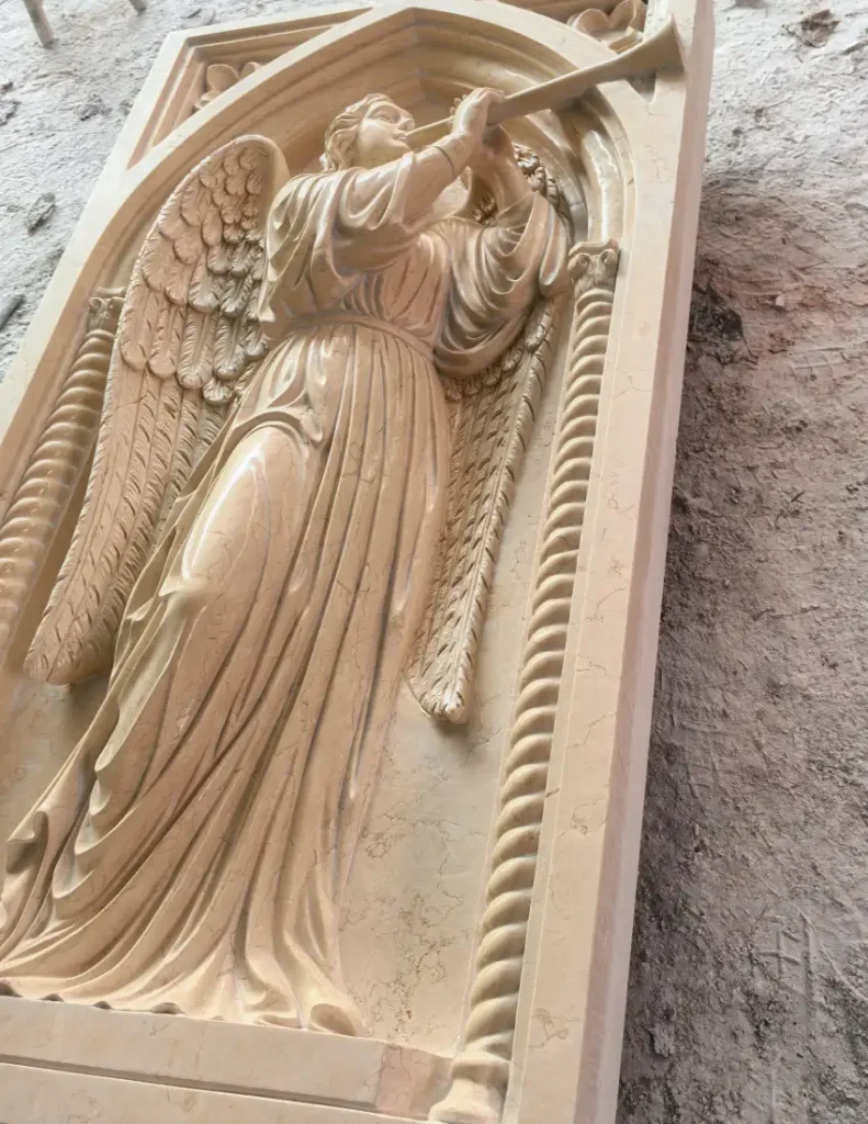 Side view of the polished St. Gabriel marble relief showing the natural marble finish