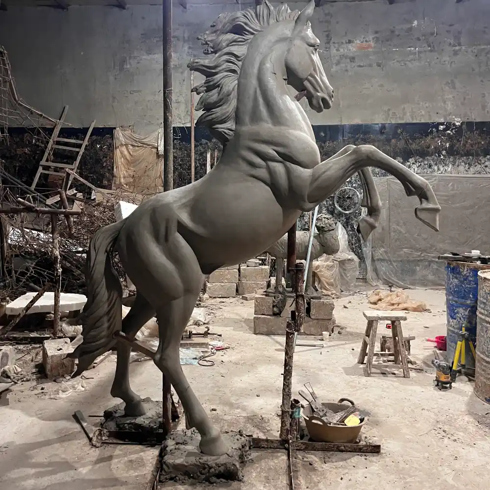 Side view of the rearing horse sculpture clay model showing the body anatomy, leg position and dynamic balance.