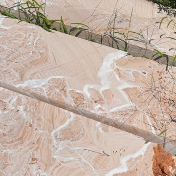 Natural red veined marble stone material with warm tones and unique patterns for custom relief sculpture