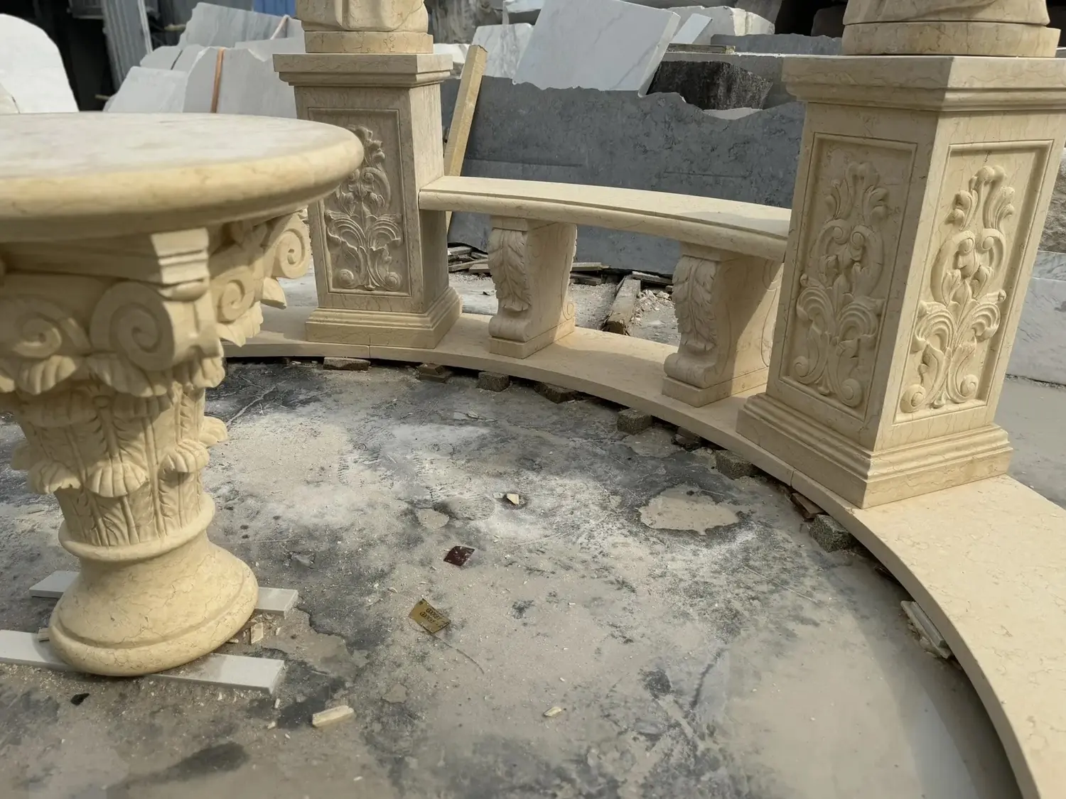 Carved natural stone column and curved balustrade detail for a marble gazebo