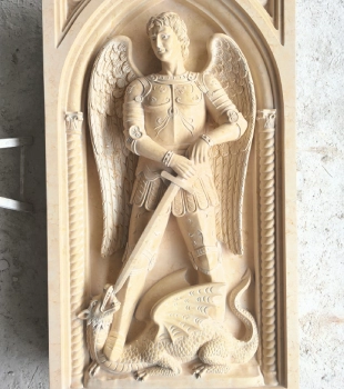 Finished St. Michael marble relief showing the polished natural stone surface