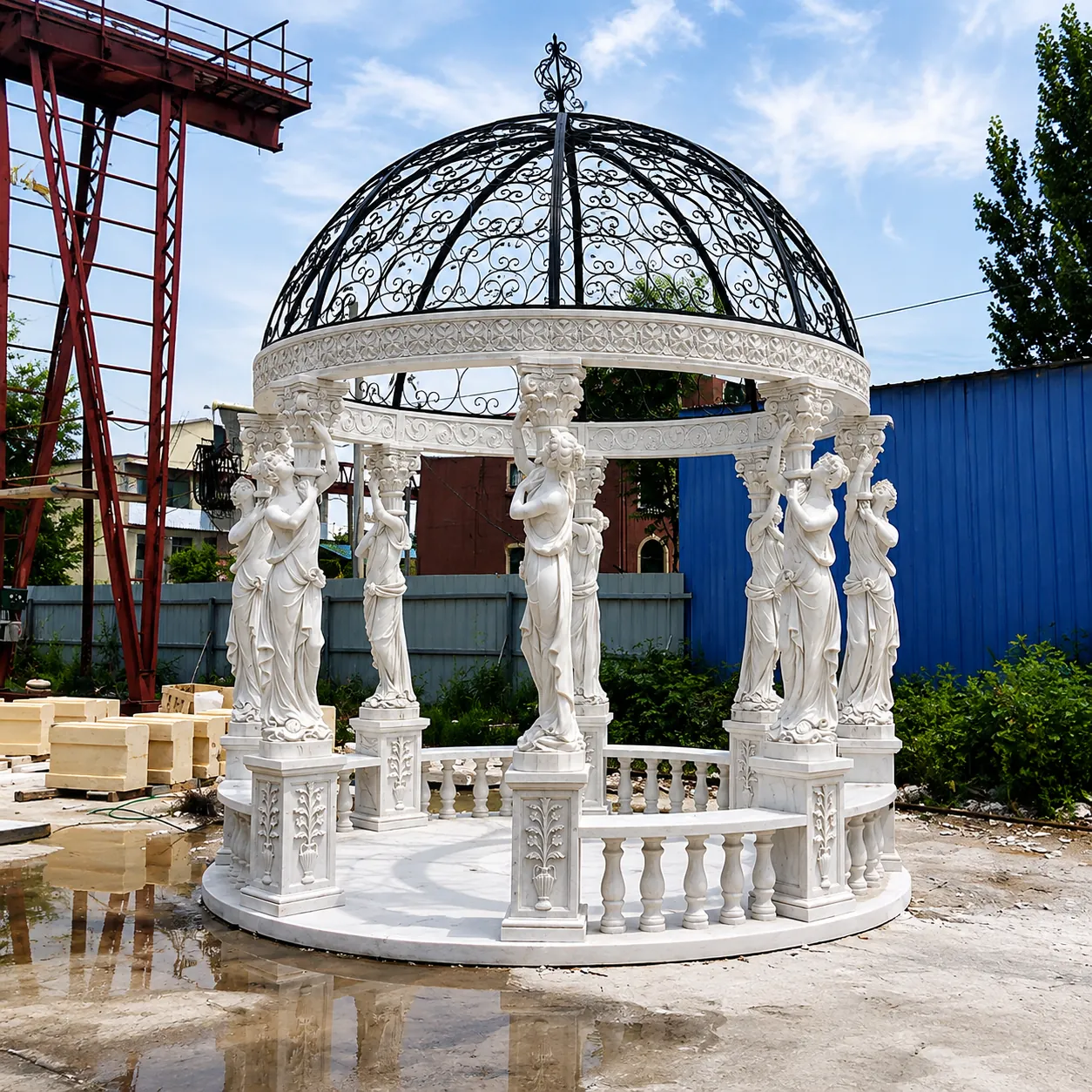 White marble caryatid gazebo with a black wrought iron dome pre-assembled at the factory