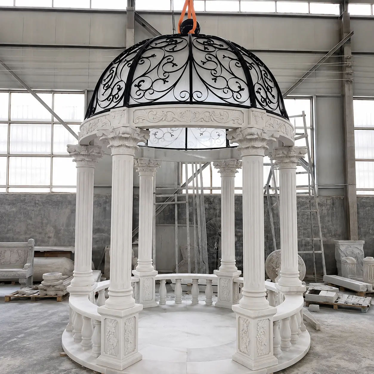 Tall column round marble gazebo with black wrought iron dome and open entrance