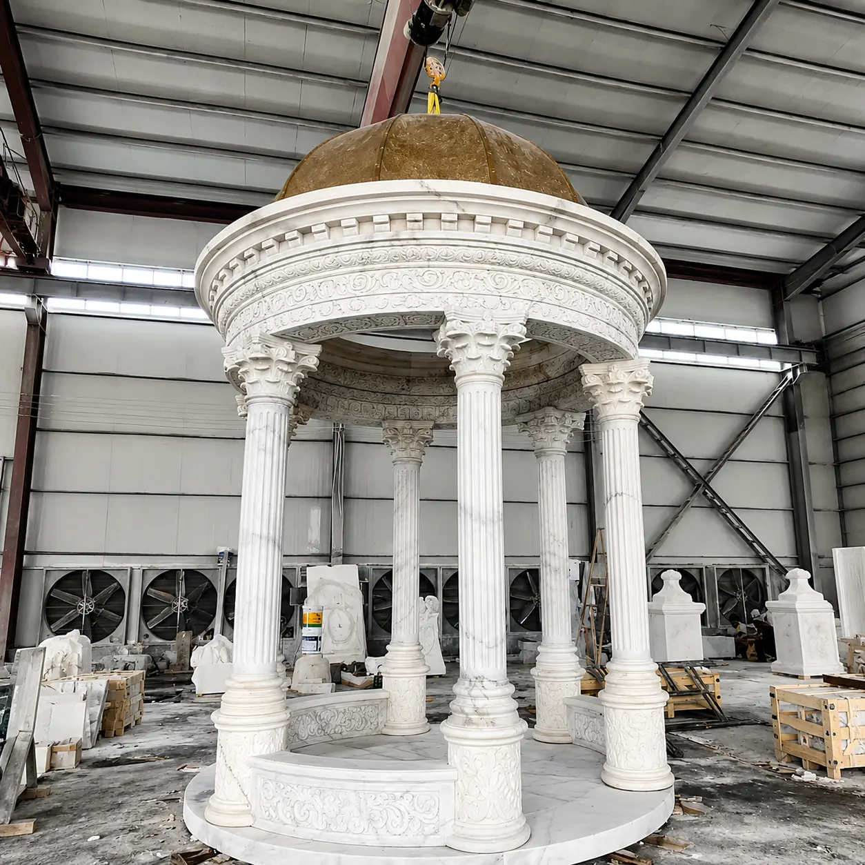 Round white marble gazebo with classical columns and covered dome in the workshop